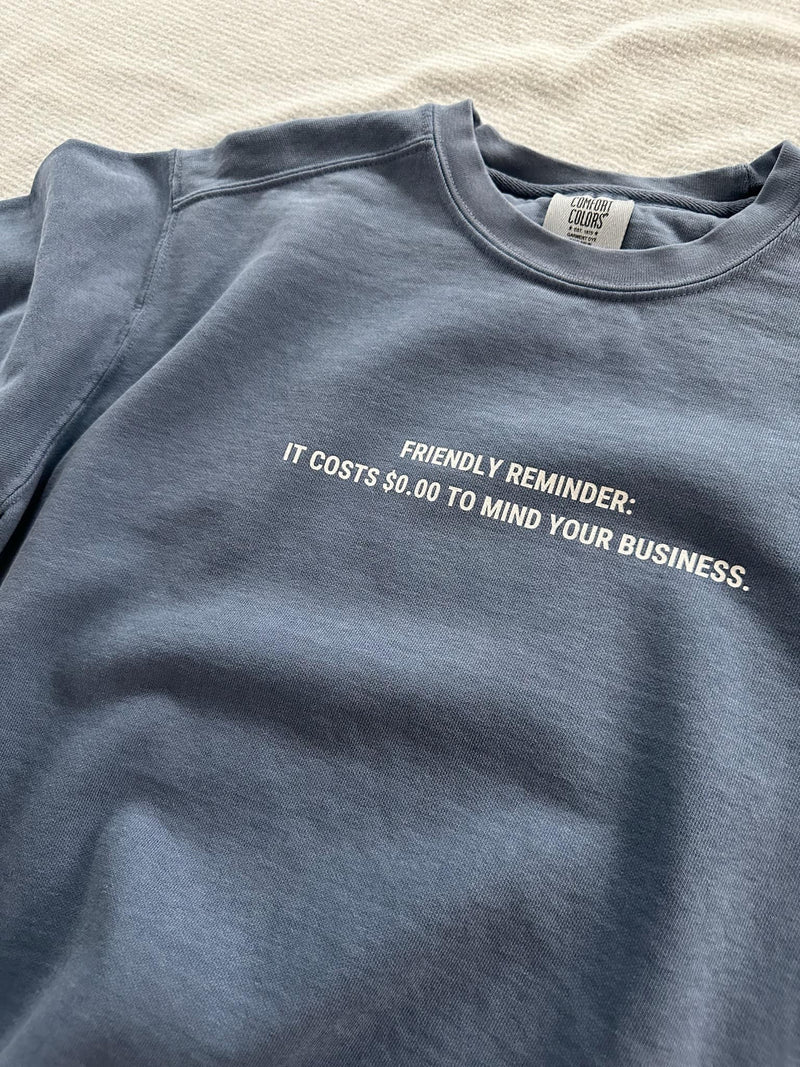 Introducing our "Mind Your Business" sweatshirt – because who says you can't be cozy and deliver a friendly reminder at the same time? 😌 Wrap yourself in sass and snuggles, all while spreading a little wisdom. The back? Packed with quirky suggestions for your spare time, because why not? Be comfy, be witty, and remember, it costs $0.00 to mind your business in style! 