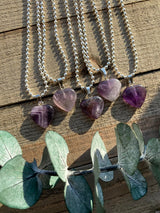 Elevate your style and embrace the soothing energy of our Amethyst Crystal Heart Necklace. This necklace radiates tranquility, spiritual growth, and emotional healing. Amethyst, known as the 'Stone of Spiritual Wisdom,' activates the Crown chakra, deepening your connection to higher realms and enhancing intuition.