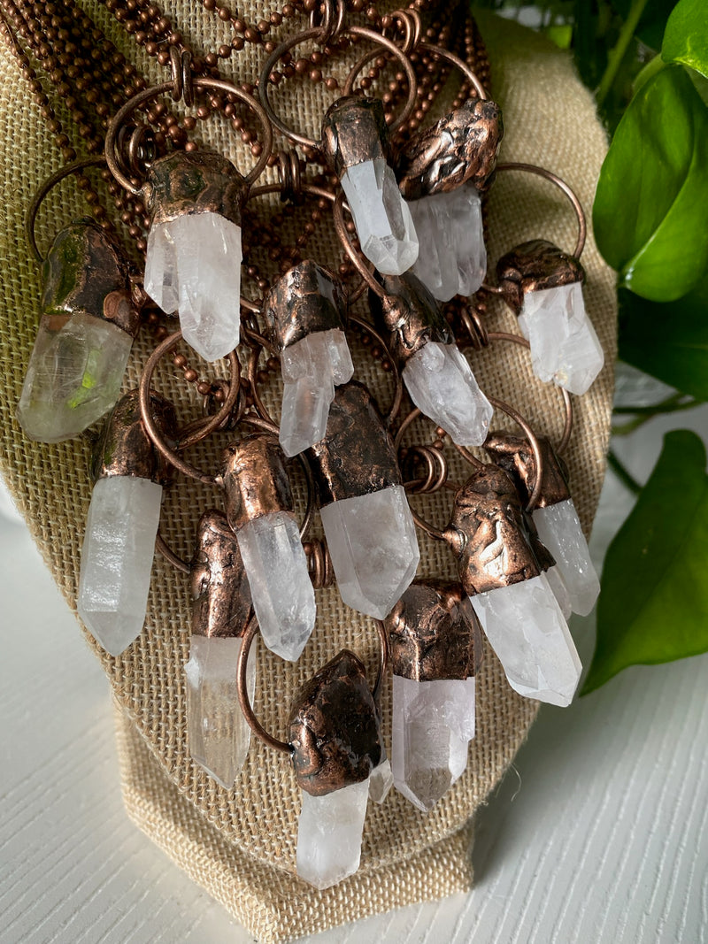 Experience the pure radiance of our electroformed clear quartz crystal necklace. Meticulously crafted, this captivating piece showcases the pristine beauty and metaphysical properties of clear quartz. Revel in the luminous clarity and amplifying energy of this remarkable crystal, as it graces your neckline with timeless elegance.