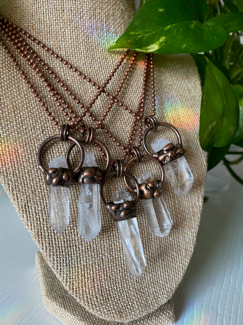 Experience the pure radiance of our electroformed clear quartz crystal necklace. Meticulously crafted, this captivating piece showcases the pristine beauty and metaphysical properties of clear quartz. Revel in the luminous clarity and amplifying energy of this remarkable crystal, as it graces your neckline with timeless elegance.