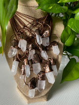 Experience the pure radiance of our electroformed clear quartz crystal necklace. Meticulously crafted, this captivating piece showcases the pristine beauty and metaphysical properties of clear quartz. Revel in the luminous clarity and amplifying energy of this remarkable crystal, as it graces your neckline with timeless elegance.