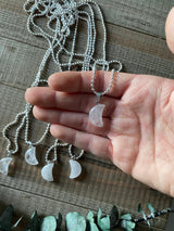 Embrace the celestial beauty and metaphysical properties of our Clear Quartz Crystal Moon Necklace. This enchanting necklace harnesses the amplifying and purifying energy of clear quartz. Radiating clarity, positivity, and spiritual connection, clear quartz promotes mental clarity, balances energies, and amplifies intentions. 