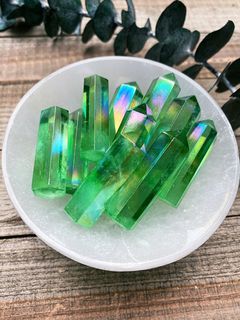 Green Aura Quartz is a crystal that holds a profound connection to the metaphysical realm, offering a multitude of transformative and healing properties. With its vibrant green hue, it resonates strongly with the heart chakra, facilitating the balance and alignment of emotions, love, and compassion. This crystal is known for its ability to open up one's heart to universal love, promoting self-acceptance, forgiveness, and inner peace.