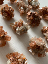 Discover the grounding and harmonizing power of raw Aragonite stones. These captivating gemstones, with their natural formations and earthy hues, offer a sense of calm and stability in your life. Embrace their metaphysical properties and experience a deep connection with the Earth's energies, fostering balance and tranquility. 