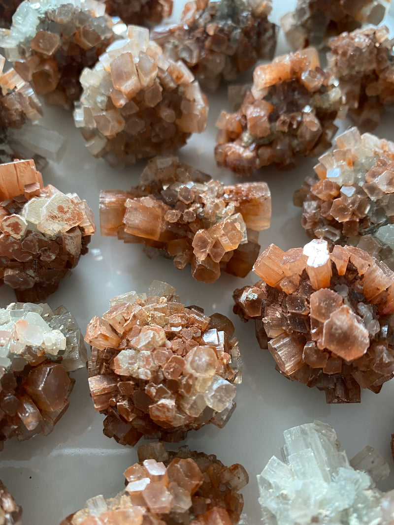 Discover the grounding and harmonizing power of raw Aragonite stones. These captivating gemstones, with their natural formations and earthy hues, offer a sense of calm and stability in your life. Embrace their metaphysical properties and experience a deep connection with the Earth's energies, fostering balance and tranquility. 