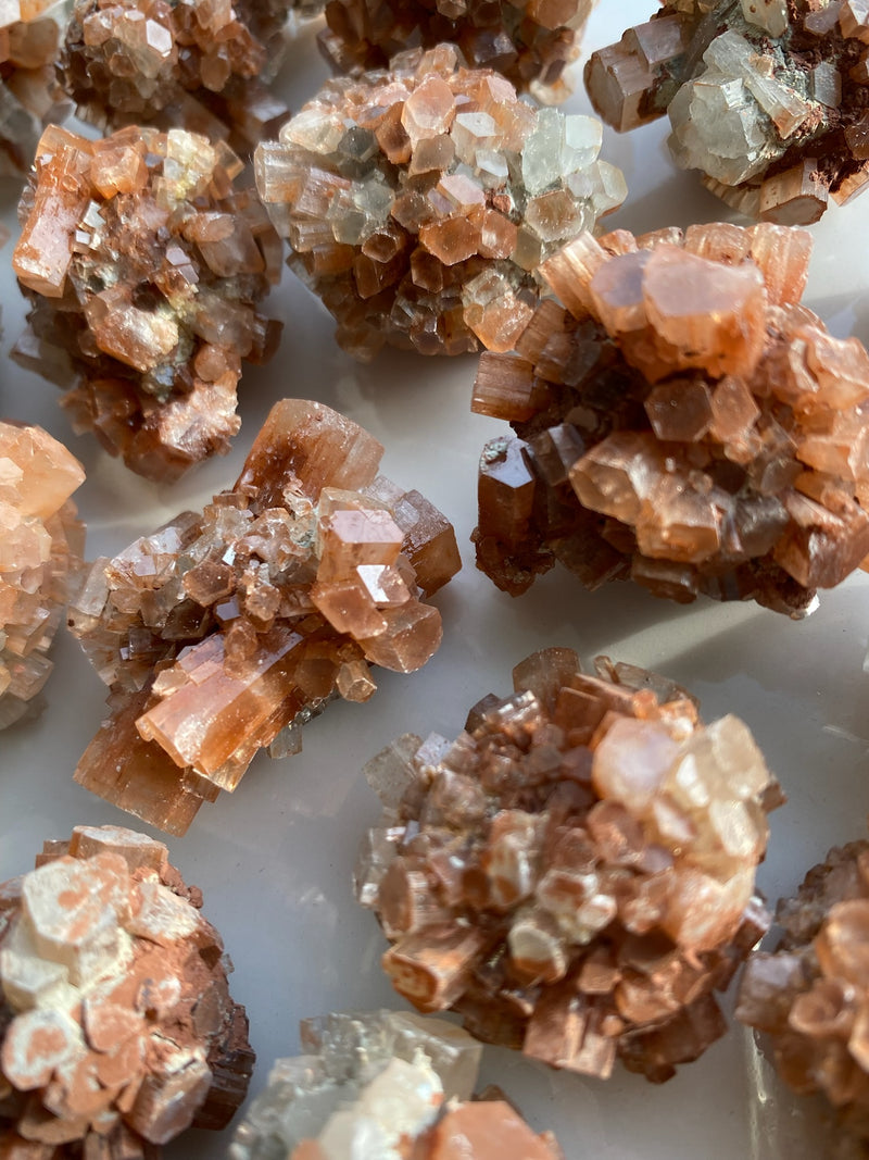 Discover the grounding and harmonizing power of raw Aragonite stones. These captivating gemstones, with their natural formations and earthy hues, offer a sense of calm and stability in your life. Embrace their metaphysical properties and experience a deep connection with the Earth's energies, fostering balance and tranquility. 