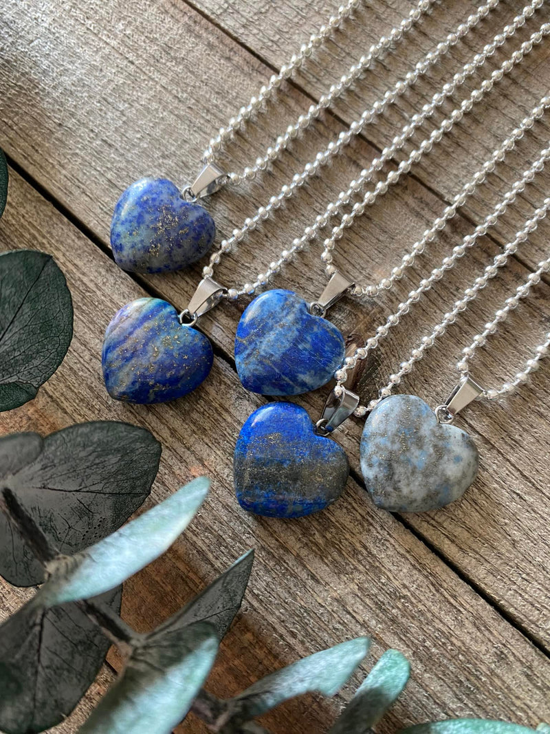 Elevate your style and embrace the majestic energy of our Lapis Lazuli Crystal Heart Necklace. This necklace radiates wisdom, truth, and spiritual enlightenment. Lapis Lazuli, known as the 'Stone of Royalty,' enhances intuition, deepens spiritual connection, and stimulates inner wisdom. 