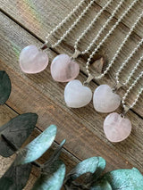 Elevate your style and embrace the loving energy of our Rose Quartz Crystal Heart Necklace. This necklace radiates compassion, healing, and unconditional love. Rose Quartz, known as the 'Stone of Love,' opens the heart chakra, fostering self-love, forgiveness, and emotional healing.