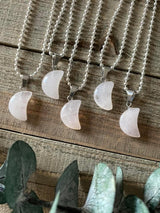 Elevate your style and embrace the loving energy of our Rose Quartz Crystal Moon Necklace. This adorable necklace radiates compassion, healing, and unconditional love. Rose quartz, known as the 'Stone of Love,' opens the heart chakra, fostering self-love, forgiveness, and emotional healing.