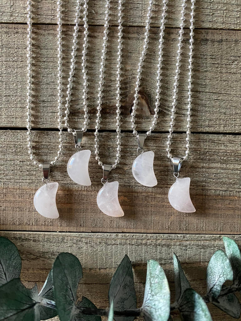 Elevate your style and embrace the loving energy of our Rose Quartz Crystal Moon Necklace. This adorable necklace radiates compassion, healing, and unconditional love. Rose quartz, known as the 'Stone of Love,' opens the heart chakra, fostering self-love, forgiveness, and emotional healing.