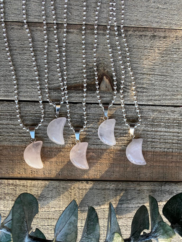 Elevate your style and embrace the loving energy of our Rose Quartz Crystal Moon Necklace. This adorable necklace radiates compassion, healing, and unconditional love. Rose quartz, known as the 'Stone of Love,' opens the heart chakra, fostering self-love, forgiveness, and emotional healing.