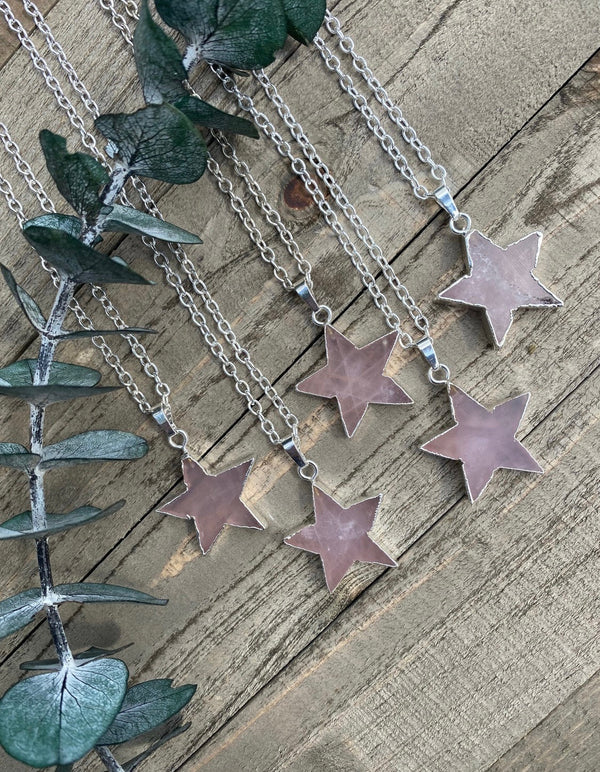 Embrace the celestial beauty of our rose quartz crystal star necklace. The star-shaped pendant, a symbol of guidance and hope, gleams with the loving energy of rose quartz, known as the stone of unconditional love.  