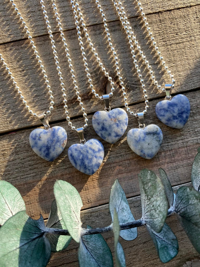 Elevate your style and embrace the harmonizing energy of our Sodalite Crystal Heart Necklace. This necklace radiates balance, intuition, and inner peace. Sodalite, known as the 'Stone of Harmony,' promotes clear communication, enhances intuition, and calms the mind.