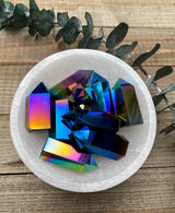 Discover the mesmerizing beauty and transformative energy of Titanium Quartz Crystal Towers. These stunning crystal formations showcase the captivating fusion of Clear Quartz and titanium, resulting in a spectrum of vibrant colors and a radiant aura. 