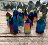 Discover the mesmerizing beauty and transformative energy of Titanium Quartz Crystal Towers. These stunning crystal formations showcase the captivating fusion of Clear Quartz and titanium, resulting in a spectrum of vibrant colors and a radiant aura. 