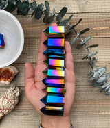 Discover the mesmerizing beauty and transformative energy of Titanium Quartz Crystal Towers. These stunning crystal formations showcase the captivating fusion of Clear Quartz and titanium, resulting in a spectrum of vibrant colors and a radiant aura. 