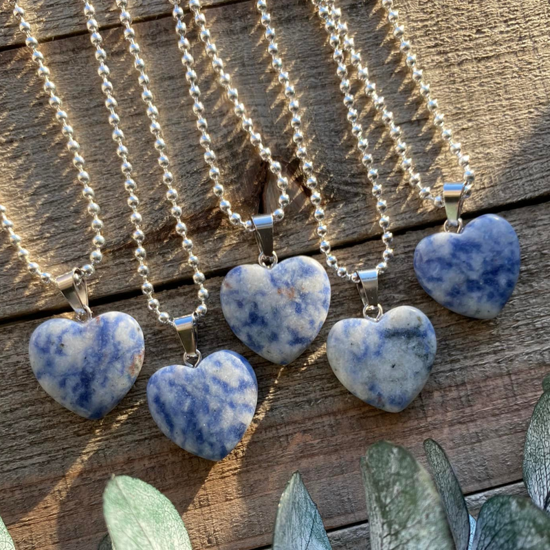 Elevate your style and embrace the harmonizing energy of our Sodalite Crystal Heart Necklace. This necklace radiates balance, intuition, and inner peace. Sodalite, known as the 'Stone of Harmony,' promotes clear communication, enhances intuition, and calms the mind.