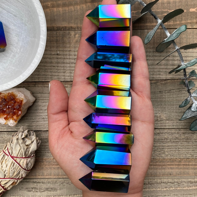 Discover the mesmerizing beauty and transformative energy of Titanium Quartz Crystal Towers. These stunning crystal formations showcase the captivating fusion of Clear Quartz and titanium, resulting in a spectrum of vibrant colors and a radiant aura. 